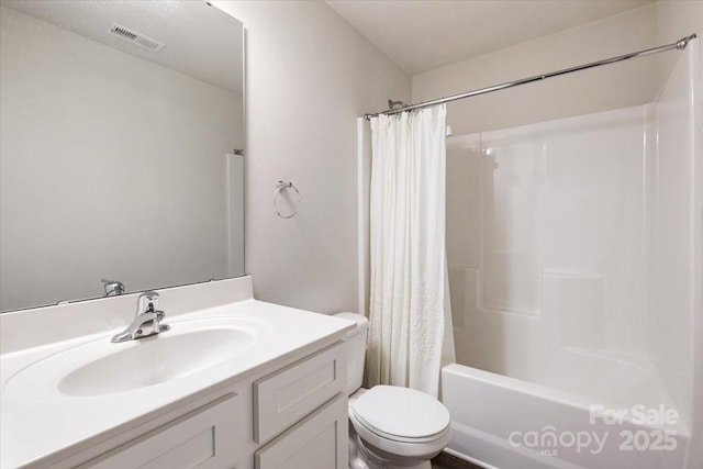 bathroom with visible vents, toilet, vanity, and shower / bathtub combination with curtain