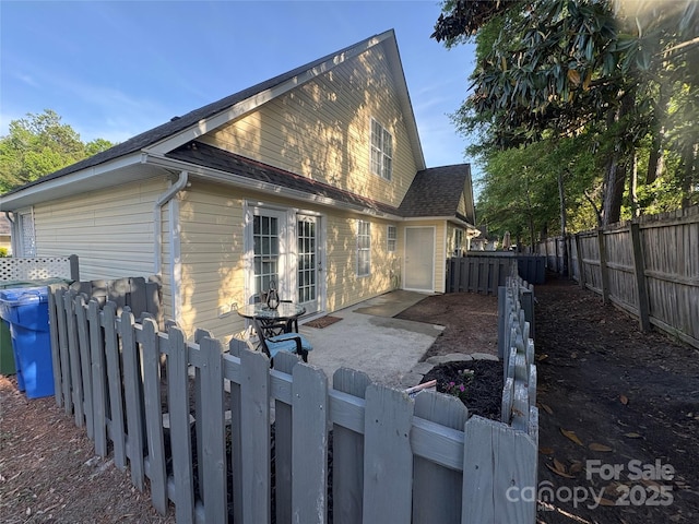 view of home's exterior featuring a fenced backyard and a patio area