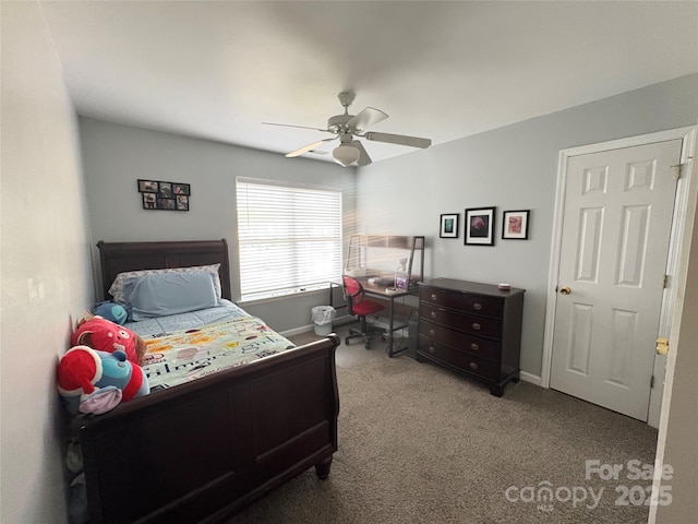 carpeted bedroom with baseboards and a ceiling fan