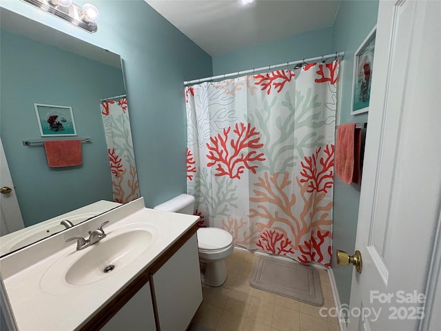 bathroom featuring a shower with shower curtain, toilet, and vanity