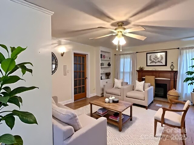 6000 S Main St, Salisbury, NC 28147 - living room featuring a ceiling fan and a fireplace with flush hearth
