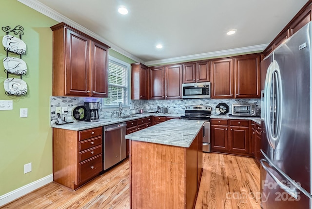 10836 Maryanna Ct, Charlotte, NC 28213 - kitchen featuring light wood-type flooring, ornamental molding, and appliances with stainless steel finishes