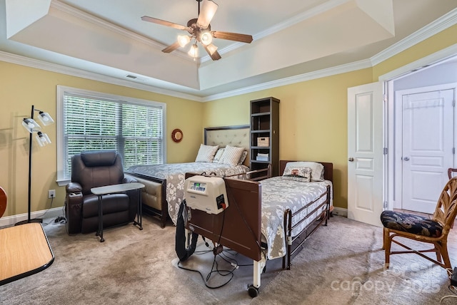 10836 Maryanna Ct, Charlotte, NC 28213 - carpeted bedroom with visible vents, ornamental molding, baseboards, a tray ceiling, and a ceiling fan