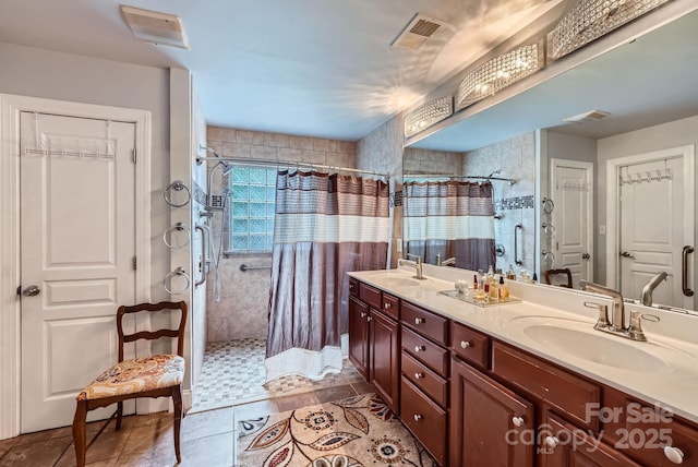 10836 Maryanna Ct, Charlotte, NC 28213 - bathroom featuring visible vents, a sink, a stall shower, and double vanity