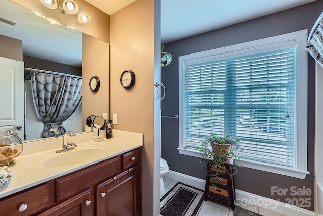 10836 Maryanna Ct, Charlotte, NC 28213 - bathroom featuring visible vents, tile patterned floors, baseboards, vanity, and toilet
