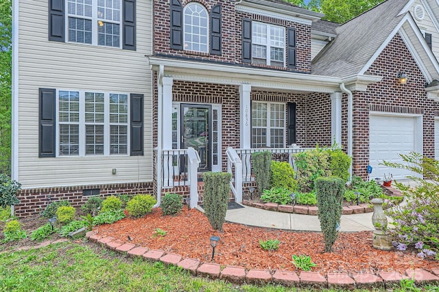 10836 Maryanna Ct, Charlotte, NC 28213 - property entrance featuring brick siding, a garage, and covered porch