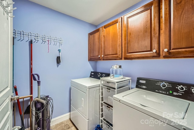 10836 Maryanna Ct, Charlotte, NC 28213 - laundry room featuring baseboards, cabinet space, and washer and dryer