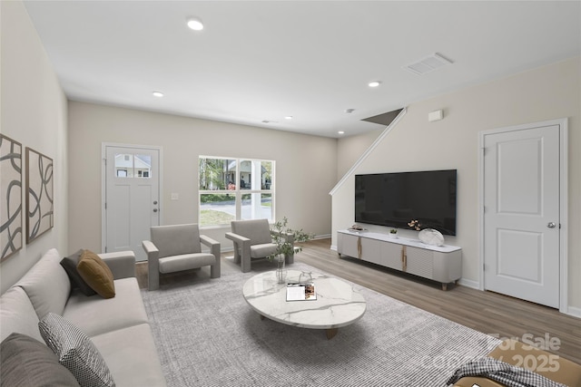 808 Carolyn Ave, Kannapolis, NC 28083 - living area with baseboards, wood finished floors, visible vents, and recessed lighting