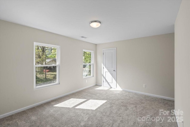 808 Carolyn Ave, Kannapolis, NC 28083 - carpeted empty room featuring baseboards and visible vents