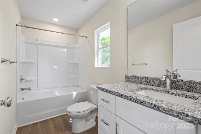 808 Carolyn Ave, Kannapolis, NC 28083 - bathroom featuring bathing tub / shower combination, wood finished floors, vanity, and toilet