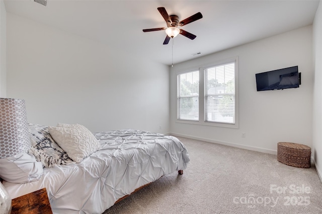 bedroom featuring baseboards, ceiling fan, carpet flooring, and visible vents
