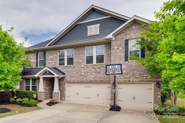 craftsman inspired home featuring an attached garage, brick siding, and concrete driveway