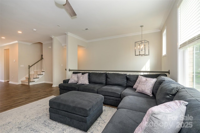 604 Tudor Park Way, Charlotte, NC 28211 - living area with crown molding, wood finished floors, a chandelier, baseboards, and recessed lighting