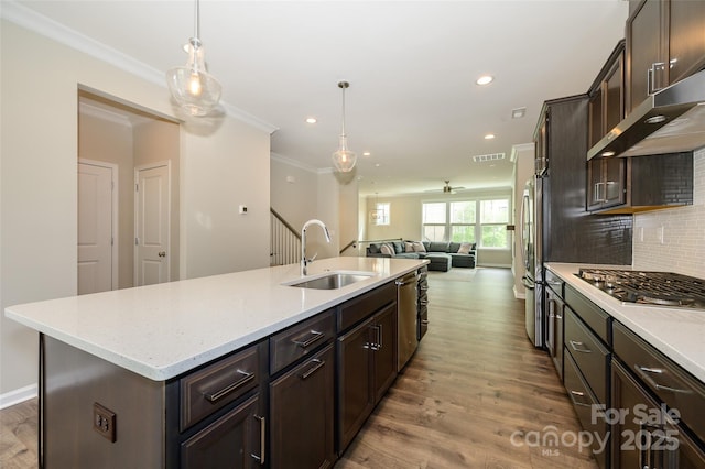 604 Tudor Park Way, Charlotte, NC 28211 - kitchen with dark brown cabinets, ornamental molding, stainless steel appliances, and a sink
