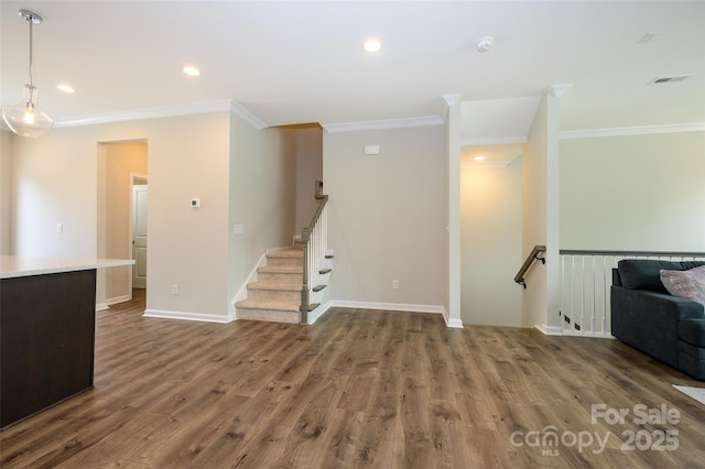 604 Tudor Park Way, Charlotte, NC 28211 - unfurnished living room featuring visible vents, baseboards, recessed lighting, wood finished floors, and ornamental molding