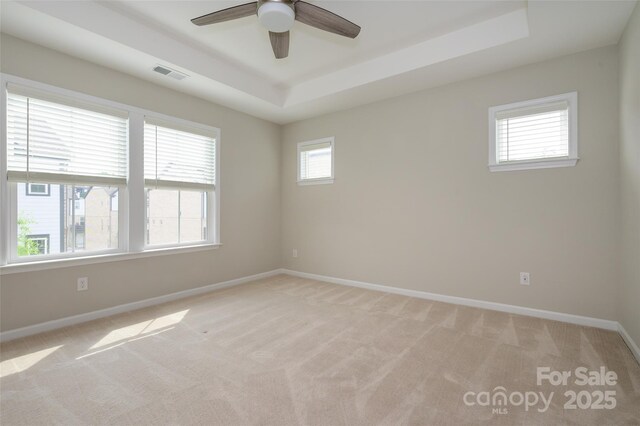 604 Tudor Park Way, Charlotte, NC 28211 - spare room featuring ceiling fan, a raised ceiling, light colored carpet, baseboards, and visible vents