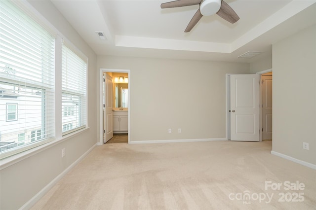 604 Tudor Park Way, Charlotte, NC 28211 - unfurnished bedroom with light colored carpet, a tray ceiling, and visible vents