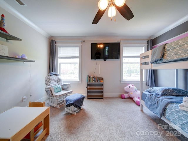 carpeted bedroom with multiple windows, baseboards, and ceiling fan