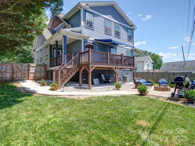 1421 Lyon Ct, Charlotte, NC 28205 - rear view of house with a deck, a patio, a fire pit, central AC unit, and stairs