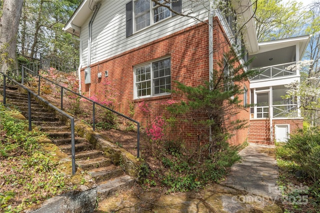 220 Ridge Rd, Waynesville, NC 28786 - view of home's exterior featuring stairs, brick siding, and a balcony