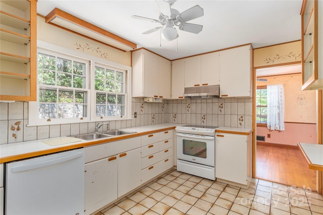 220 Ridge Rd, Waynesville, NC 28786 - kitchen featuring white appliances, under cabinet range hood, light countertops, ceiling fan, and backsplash