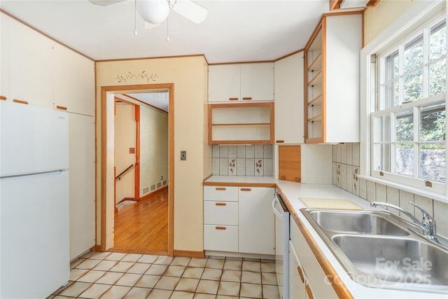 220 Ridge Rd, Waynesville, NC 28786 - kitchen featuring white appliances, backsplash, light countertops, white cabinetry, and ceiling fan