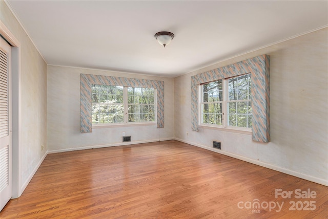 220 Ridge Rd, Waynesville, NC 28786 - spare room with light wood-style flooring, plenty of natural light, and crown molding