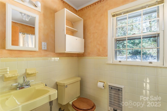 220 Ridge Rd, Waynesville, NC 28786 - full bath with tile walls, crown molding, heating unit, and wainscoting