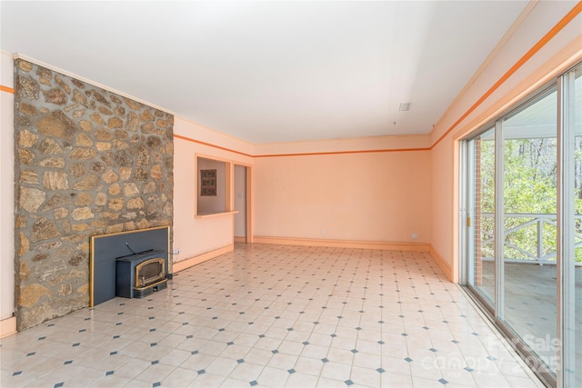 220 Ridge Rd, Waynesville, NC 28786 - empty room with a wood stove and ornamental molding