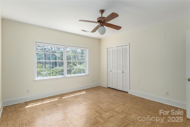 220 Ridge Rd, Waynesville, NC 28786 - unfurnished bedroom featuring a closet and a ceiling fan