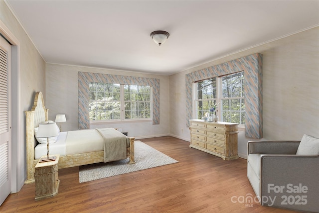 220 Ridge Rd, Waynesville, NC 28786 - bedroom featuring multiple windows and wood finished floors