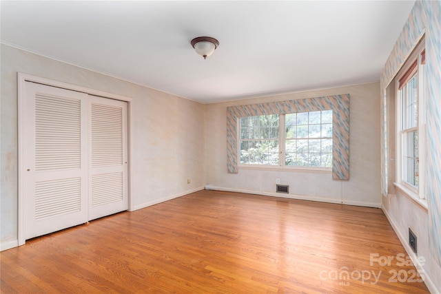 220 Ridge Rd, Waynesville, NC 28786 - unfurnished bedroom with wood finished floors, a closet, and ornamental molding