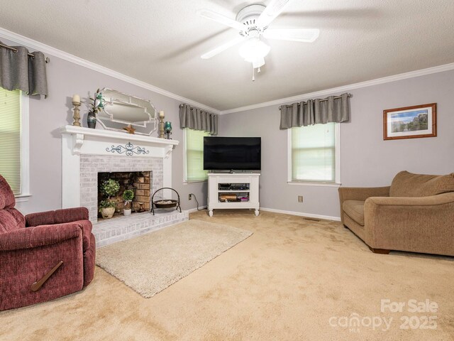 carpeted living room featuring crown molding, a textured ceiling, ceiling fan, a fireplace, and baseboards