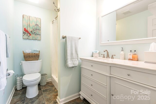 bathroom featuring toilet, a shower with curtain, baseboards, stone finish floor, and visible vents