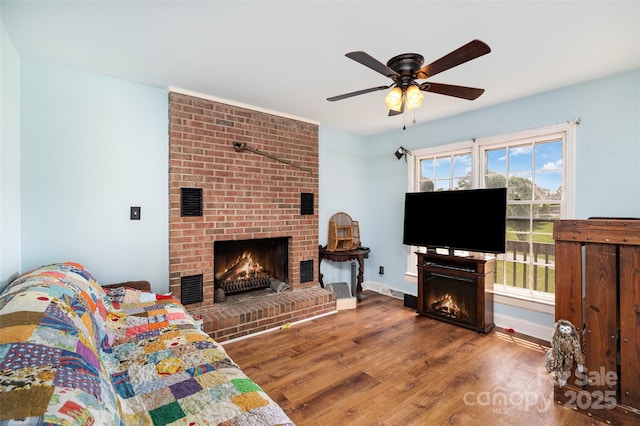 109 Terrace Pl, Lincolnton, NC 28092 - living area with a brick fireplace, wood finished floors, ceiling fan, and baseboards