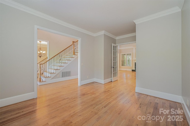 108 Bare Foot Ln, Mooresville, NC 28117 - spare room with stairway, crown molding, wood finished floors, baseboards, and visible vents
