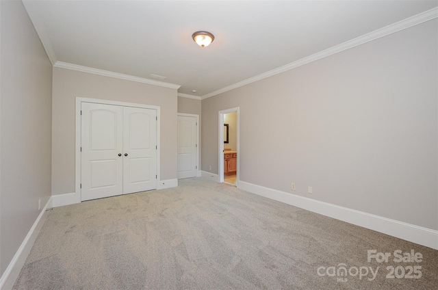 108 Bare Foot Ln, Mooresville, NC 28117 - unfurnished bedroom featuring light carpet, baseboards, a closet, ensuite bath, and ornamental molding