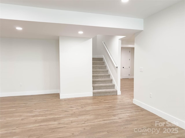 1123 Fern Hill Rd, Mooresville, NC 28117 - finished basement with recessed lighting, light wood finished floors, and stairway