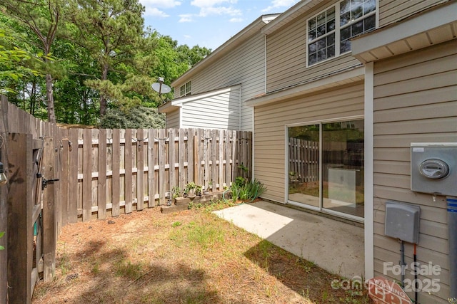 view of yard featuring a patio and fence