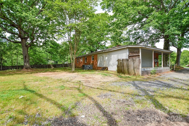 view of yard with fence and entry steps