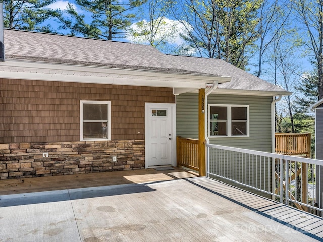 1938 Upper Ridgewood Blvd, Hendersonville, NC 28791 - entrance to property featuring stone siding, a wooden deck, and a shingled roof