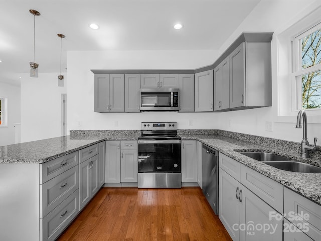 1938 Upper Ridgewood Blvd, Hendersonville, NC 28791 - kitchen with a peninsula, appliances with stainless steel finishes, gray cabinetry, and a sink