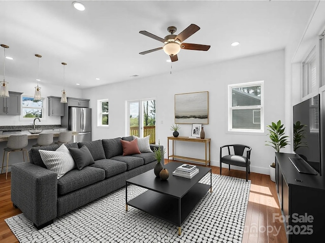 1938 Upper Ridgewood Blvd, Hendersonville, NC 28791 - living area with a wealth of natural light, a ceiling fan, wood finished floors, and recessed lighting