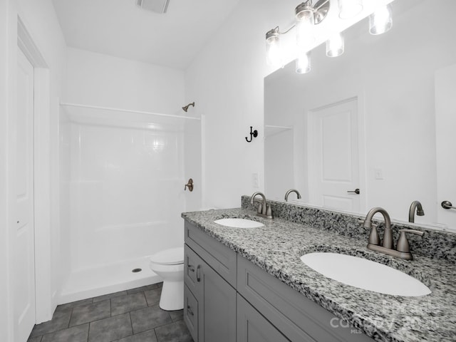 1938 Upper Ridgewood Blvd, Hendersonville, NC 28791 - bathroom with walk in shower, tile patterned floors, toilet, and a sink