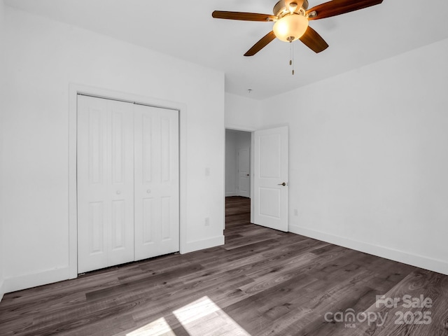 1938 Upper Ridgewood Blvd, Hendersonville, NC 28791 - unfurnished bedroom featuring wood finished floors, a closet, baseboards, and ceiling fan
