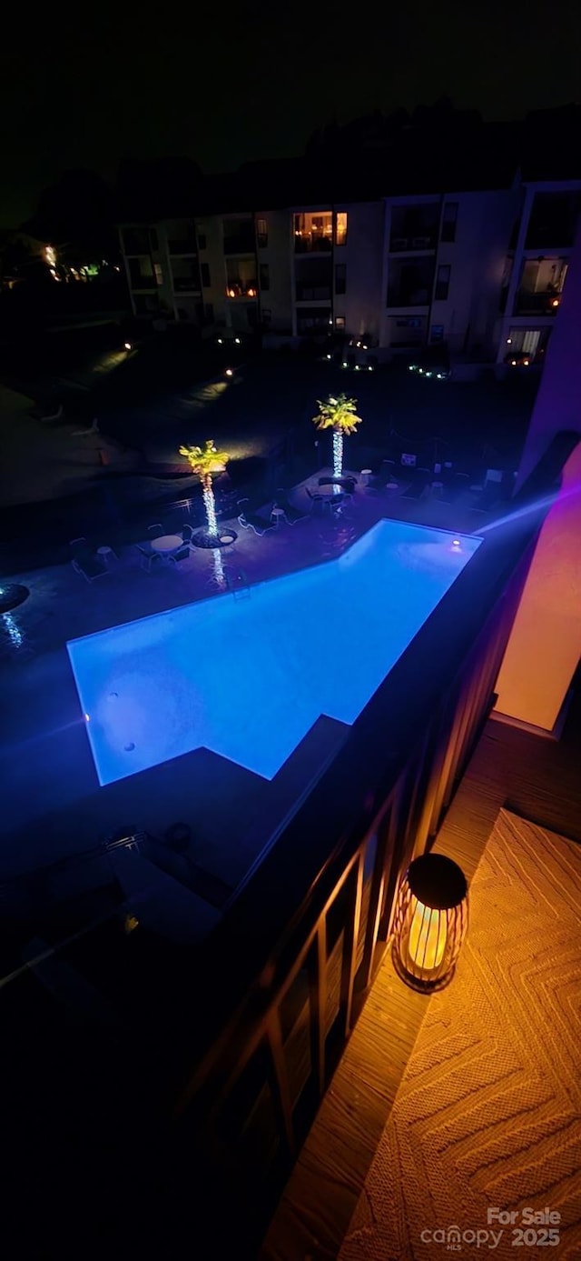 17810 Half Moon Ln Unit L, Cornelius, NC 28031 - pool at night featuring a jacuzzi