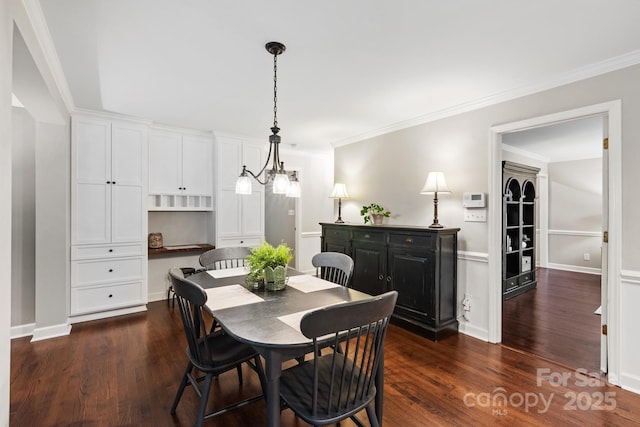 dining area featuring crown molding, baseboards, and dark wood-type flooring