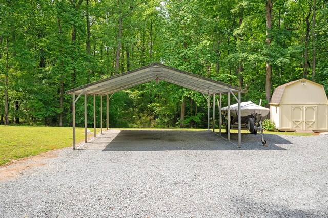 surrounding community with an outdoor structure, a yard, a storage shed, driveway, and a detached carport