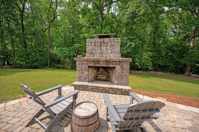 view of patio / terrace with an outdoor stone fireplace