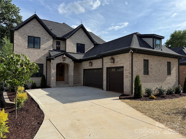 724 Ideal Way, Charlotte, NC 28203 - french provincial home featuring brick siding, driveway, a garage, and a shingled roof